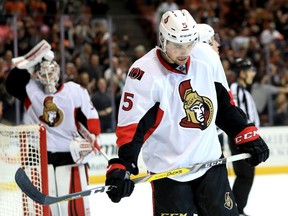 Ottawa Senators defenceman Cody Ceci (right) looks down after an Anaheim Ducks goal on Dec. 11.