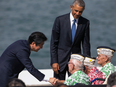 Japanese Prime Minister Shinzo Abe and U.S. President Barack Obama speak with Pearl Harbor veterans, from left, Sterling Cale, Al Rodrigues and Everett Hyland at Joint Base Pearl Harbor Hickam, Tuesday, Dec. 27, 2016, in Honolulu.
