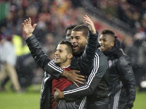 Toronto FC star player Sebastian Giovinco (LEFT) is hugged by teamate Jordan Hamilton after they won 5-2 against the Montreal Impact to take the MLS Eastern Conference Championship at Toronto's BMO Field, Wednesday November 30, 2016.