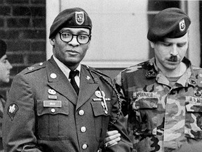 In this April 6, 1988, file photo, Ronald Gray leaves a courtroom escorted by military police at Fort Bragg, N.C.