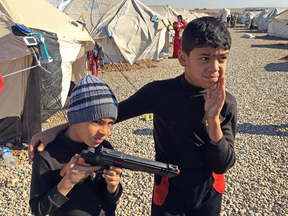 Mustafa and his brother, Ahmed, dressed entirely in black — the preferred uniform of ISIL jihadists.