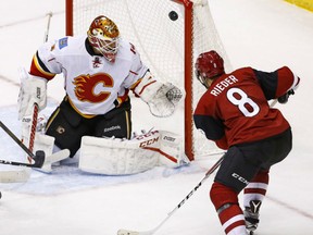 Calgary Flames' goaltender Brian Elliott stops Tobias Rieder of the Arizona Coyotes on the short side during Monday night NHL action in Glendale, Az. Elliott made his return to the Calgary lineup in triumphant one with a 4-2 victory, stopping a two-game Flames' slide. Elliott was making his first start in nine games after losing the No. 1 job to Chad Johnson.