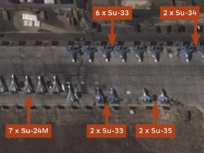 Satellite imagery shows Su-33 jets parked among Russian Aerospace Forces aircraft at Khmeimim air base in Syria on Nov. 20