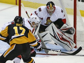 Bryan Rust of the Pittsburgh Penguins finds the five-hole between the pads of Ottawa Senators' goaltender Craig Anderson during NHL action Monday night in Pittsburgh. Rust had three goals in the Penguins' 8-5 victory.