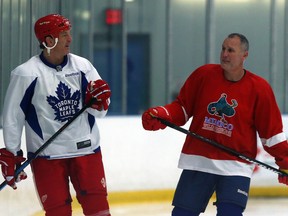 Former Red Wings Brendan Shanahan and Paul Coffey chat during practice ahead of the Centennial Classic Alumni Game in Toronto on Thursday December 29, 2016.