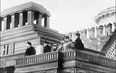 Top Soviet officials standing at the balcony of the Lenin Mausoleum (from left) V. Kuybyshev, Mikhail Ivanovich Kalinin, Joseph Stalin, Grigori Konstantionovitch Ordjonikidze and Felix Kon, review a military parade in 1926.