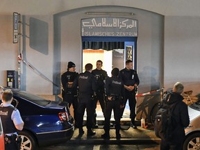 Police secure the area in front of the Islamic center, in Zurich, Monday, Dec. 19, 2016.