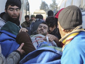 An injured Syrian arrives at a refugee camp in Rashidin, near Idlib, Syria, after was evacuated from the embattled Syrian city of Aleppo during the ceasefire, Tuesday, Dec. 20, 2016