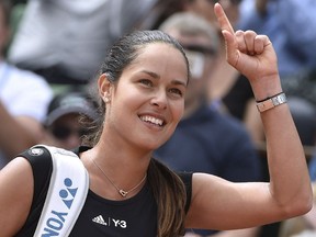 Serbia's Ana Ivanovic celebrates after winning her match against Ukraine's Elina Svitolina during the women's quarter-finals of the Roland Garros 2015 French Tennis Open in Paris on June 2, 2015.