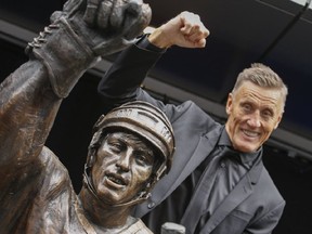 Borje Salming poses with his Legends Row statue outside the Air Canada Centre when it was unveiled in September 2015.