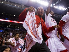 Toronto Raptors guard Kyle Lowry (centre) celebrates a late dunk against the Atlanta Hawks on Dec. 3.