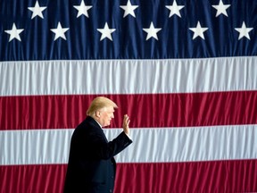 President-elect Donald Trump arrives for a rally in a DOW Chemical Hanger at Baton Rouge Metropolitan Airport, Friday, Dec. 9, 2016, in Baton Rouge, La.