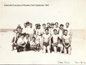 Japanese men who were housed at the Eatonville Roadhouse on a visit to the Rondeau Park beach.