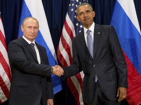 In this Monday, Sept. 28, 2015 file photo, U.S. President Barack Obama, shakes hands with Russia's President President Vladimir Putin