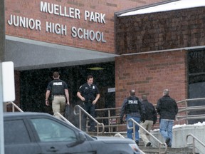 Police officers respond to Mueller Park Junior High after a student fired a gun into the ceiling in Bountiful, Utah on Thursday, Dec. 1, 2016.