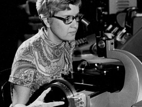 In this image taken in the 1970s and provided by the Carnegie Institution of Washington, Vera Rubin uses a measuring engine.