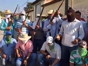 Men in the streets of Totolapan wave shotguns and hunting rifles, and, in a video, call for action against El Tequilero.