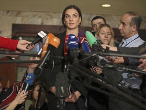 Former Russian pole vaulter Yelena Isinbayeva speaks to the media in Moscow on Friday, Dec. 9, 2016. She says she will oppose blanket bans of Russian athletes after being named the head of the suspended Russian anti-doping agency's new supervisory board.