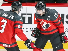 Team Canada's Dylan Strome celebrates his goal against Sweden with teammate Noah Juulsen during the third period of their semifinal game at the world junior hockey championship in Montreal on Wednesday night.