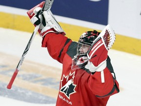 Team Canada goalie Carter Hart celebrates after his team's 5-2 victory over Sweden in their semifinal game at the world junior hockey championship in Montreal on Wednesday night.