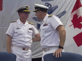 Royal Canadian Navy Vice-Admiral Mark Norman (left) speaks with Vice-Admiral Ron Lloyd during a change of command ceremony, Thursday, June 23, 2016 in Ottawa.