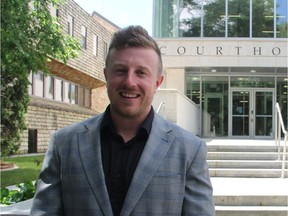 Former University of Saskatchewan football player Seamus John Neary, who was sentenced to two years probation following a Nov. 2015 conviction on charges of trafficking marijuana and possessing the proceeds of crime, poses for a photo outside of Saskatoon's Court of Queen's Bench on Thursday afternoon following the ruling.