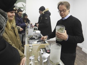 MONTREAL, QUE.: DECEMBER 16, 2016 -- Marc Emery, right, dispenses marijuana to clients at Cannabis Culture store on Mount Royal on Friday December 16, 2016. (Pierre Obendrauf / MONTREAL GAZETTE) ORG XMIT: 57804 - 1063