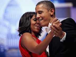 U.S. President Barack Obama and first lady Michelle Obama sing together as they dance during the Inaugural Ball at the Walter Washington Convention Center January 21, 2013 in Washington, DC.