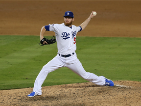 In this Oct. 15, 2013 file photo, then-Los Angeles Dodgers reliever J.P. Howell pitches against the St. Louis Cardinals in the NLCS.