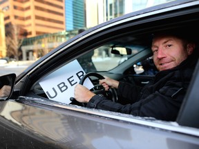 Uber driver Mike Commodore and former Calgary Flames, poses for a photo at the launch of uber in Calgary, Alta., on Tuesday December 6, 2016.
