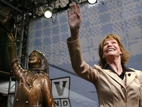 Actress Mary Tyler Moore Waves To The Crowd Next To The Statue honouring her, May 8, 2002 in Minneapolis, Mn