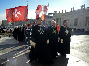 Knights of the Order of Malta walk in procession towards St.Peter's Basilica to mark the 900th anniversary of the Order of the Knights of Malta, on February 9, 2013 at the Vatican.