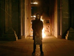 Russian artist Pyotr Pavlensky poses after setting fire to the doors of the headquarters of the FSB security service, the successor to the KGB, in central Moscow early on November 9, 2015