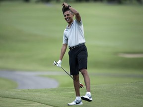 Obama arrives on the 18th hole of the Mid-Pacific Country Club's golf course December 21, 2015 in Kailua, Hawaii