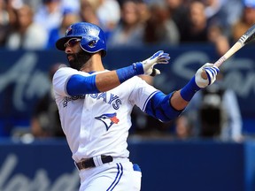 Toronto Blue Jays outfielder Jose Bautista singles against the New York Yankees on Sept. 25.