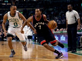 Toronto Raptors guard Kyle Lowry (centre) drives past Boston Celtics guard Avery Bradley (left) on Dec. 9.