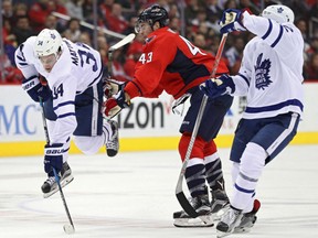 Auston Matthews of the Toronto Maple Leafs is checked by Tom Wilson of the Capitals during the second period at Verizon Center in Washington on Tuesday night.