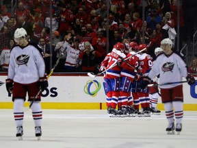 Members of the Washington Capitals celebrate a thrid period goal against the Columbus Blue Jackets at Verizon Center on Thursday in Washington, DC.
