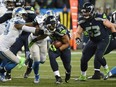Thomas Rawls of the Seahawks carries the ball during the first half against the Detroit Lions in the NFC wild card game at CenturyLink Field in Seattle on Saturday night.