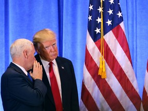President-elect Donald Trump stands with Vice President-elect Mike Pence at a news conference at Trump Tower on Jan. 11, 2017 in New York City.