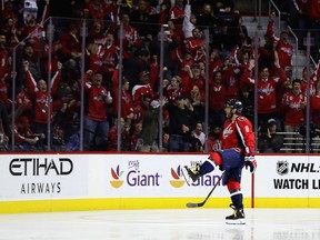 Alex Ovechkin #8 of the Washington Capitals celebrates after scoring a goal for his 1000th career point against the Pittsburgh Penguins in the first period at Verizon Center on January 11, 2017 in Washington, DC.