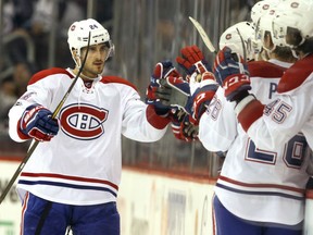 Phillip Danault  of the Montreal Canadiens celebrates his second goal against the Jets during their game on Wednesday night at the MTS Centre in Winnipeg.