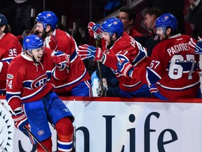 Alexei Emelin celebrates his goal with his teammates on the Canadiens bench during their game against the New York Rangers at the Bell Centre in Montreal on Saturday night. The Canadiens beat the Rangers 5-4.