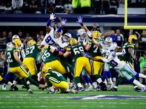 Mason Crosby of the Green Bay Packers kicks a field goal to beat the Dallas Cowboys 34-31 in the NFC Divisional Playoff Game on Jan. 15.