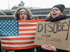 Protestors rally during a protest against the Muslim immigration ban at John F. Kennedy International Airport on Jan. 28 in New York City. President Trump singed the controversial executive order that halted refugees and residents from predominantly Muslim countries from entering the United States.