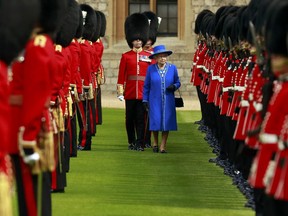 Queen Elizabeth II inspects the 1st Battalion Welsh Guards at Windsor Castle on April 30, 2015 in London, United Kingdom