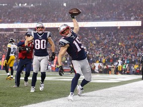 New England Patriots receiver Chris Hogan (right) spikes the ball after scoring against the Pittsburgh Steelers on Jan. 22.