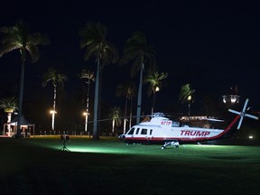 A Trump helicopter sits on the lawn at Mar-a-Lago near the red carpet for arrivals of the New Year's Eve party on December 31, 2016 at Mar-a-Lago in Palm Beach, Florida.
