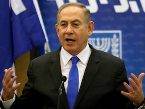 Israeli Prime Minister Benjamin Netanyahu gestures during a Likud faction meeting at the Knesset in Jerusalem on  January 2. Netanyahu denied any wrongdoing ahead of his expected questioning by police in a graft probe, telling his political opponents to put any "celebrations" on hold.