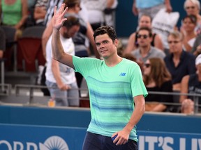 Milos Raonic of Canada celebrates his victory over Diego Schwartzman of Argentina after their men's singles second round match at the Brisbane International tennis tournament in Brisbane on January 5, 2017.
